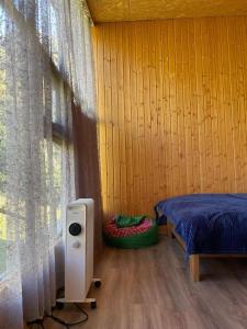 a bedroom with a bed and a window at Mtissa in Jut'a +70 photos