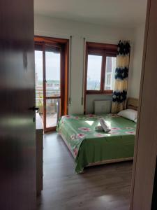 Ένα ή περισσότερα κρεβάτια σε δωμάτιο στο Punto FM