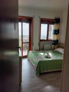 Ένα ή περισσότερα κρεβάτια σε δωμάτιο στο Punto FM +11 φωτογραφίες