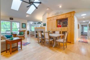 a kitchen and living room with a table and chairs at Blue Ridge Mtn Retreat Porches and Creek Access in Hendersonville