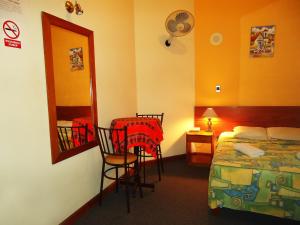 Cama ou camas em um quarto em Novo Bonbini