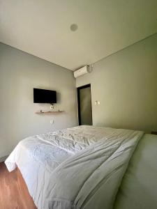Postel nebo postele na pokoji v ubytování Makarma Resort Lombok