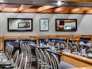a dining room filled with tables and chairs at Heritage Inn Hotel & Convention Centre - Saskatoon in Saskatoon