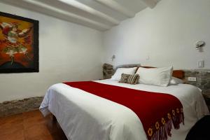 Ένα ή περισσότερα κρεβάτια σε δωμάτιο στο Huascaran Casa Boutique San Blas