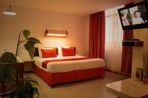 Postel nebo postele na pokoji v ubytování Hotel Enriquez