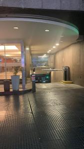 an empty hallway of an airport with a building at Apart Rilax in Buenos Aires