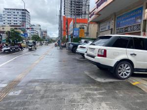 a white van parked on the side of a city street at Jianpuke Space Capsule Backpacker Hostel in Sihanoukville