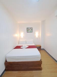 Postel nebo postele na pokoji v ubytování Virginia Suites
