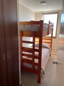 a bedroom with two bunk beds in a room at Departamento Aníbal Pinto Concepción in Concepción +5 photos