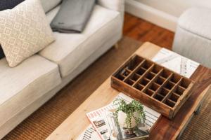 a coffee table in a living room with a couch at Benambra Cottage c1860 in Queenscliff +20 photos