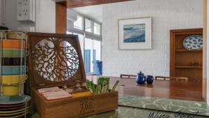 a room with a table and a wooden box at Vintage Vista By Wine Coast Holidays in Port Willunga +15 photos