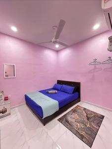 Postel nebo postele na pokoji v ubytování Ammaiti Homestay Kulim