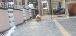 a small bird house sitting outside of a building at Bbunga cozy apartment in Kampala