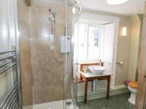a bathroom with a shower and a sink at Hill House Farm in Northampton +43 photos