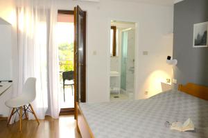 Ein Bett oder Betten in einem Zimmer der Unterkunft Apartments Villa Tre Marie
