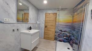 a bathroom with a shower and a sink at Pension Haus Germania in Erfurt +33 photos