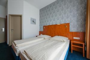 Postel nebo postele na pokoji v ubytování Hotel Mirage