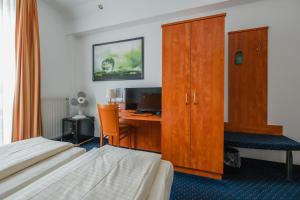 Postel nebo postele na pokoji v ubytování Hotel Mirage