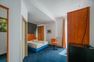Postel nebo postele na pokoji v ubytování Hotel Mirage