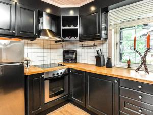 Kuchyň nebo kuchyňský kout v ubytování 5 star holiday home in Treungen