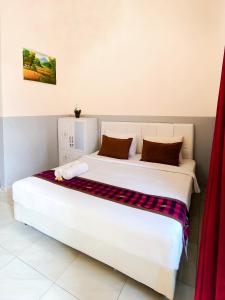 Postel nebo postele na pokoji v ubytování Guest House 88 Pandawa