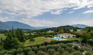 an aerial view of a villa with a garden and a swimming pool at NEW Villa Tosca in Bardolino