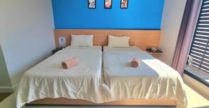 Postel nebo postele na pokoji v ubytování I Hotel Khonkaen