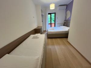 Katil atau katil-katil dalam bilik di Hotel Al Pescatore