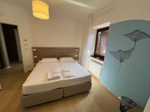Katil atau katil-katil dalam bilik di Hotel Al Pescatore
