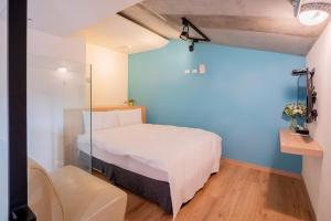 En eller flere senger på et rom på CHECK inn Express Taichung Yizhong