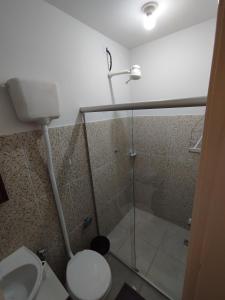 a bathroom with a shower with a toilet and a sink at Apto 5 ótimo local proximo shopping in Campo Grande +1 photo