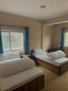 Hotel Siddhartha & Khanglo Thakali Bhancha Ghar客房内的一张或多张床位