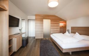 Posteľ alebo postele v izbe v ubytovaní Hotel Gasthof Wieser