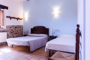Cama o camas de una habitación en Agroturisme Sant Dionis
