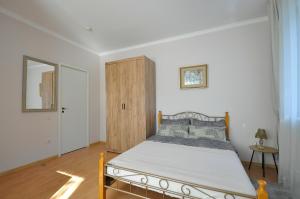 Postel nebo postele na pokoji v ubytování Prestige Apartment