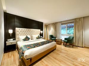 Postel nebo postele na pokoji v ubytování Hotel Rockland Residency