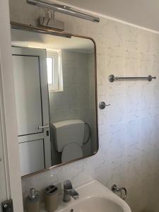 A bathroom at Sindonia beach Apartment's