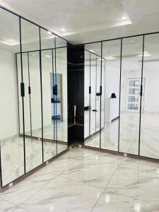 a large room with glass doors on the wall at Mafjoint3 in Zeerust