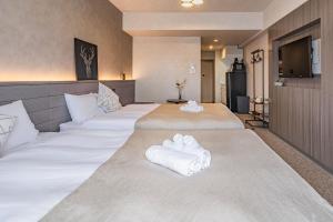 Letto o letti in una camera di Apartment Hotel 11 Shinsaibashi 2