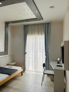 Postel nebo postele na pokoji v ubytování Hotel Maksim