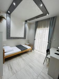 Postel nebo postele na pokoji v ubytování Hotel Maksim