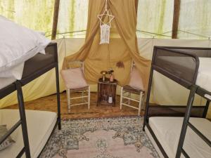 Postel nebo postele na pokoji v ubytování Tipi Luna