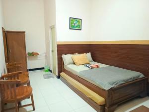 Postel nebo postele na pokoji v ubytování Kedung Ombo Homestay