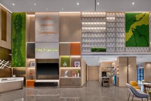 Ruang duduk di Home2 by Suite Wuhan Qingshan
