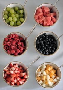 four bowls filled with different types of fruit at Montagu Place Hotel in London