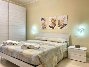 Postel nebo postele na pokoji v ubytování Casa Nina - 10' dalla spiaggia