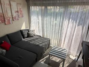 En eller flere senge i et værelse på Appartement avec Piscine