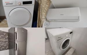 a bathroom with a washing machine and a refrigerator at Nicolle Elite Apartment in Piteşti