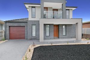 a rendering of a house with a garage at Palm Grove Beach House Dromana in Dromana