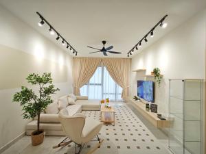 a living room with a couch and a tv at Southkey Mosaic by Antlerzone in Johor Bahru